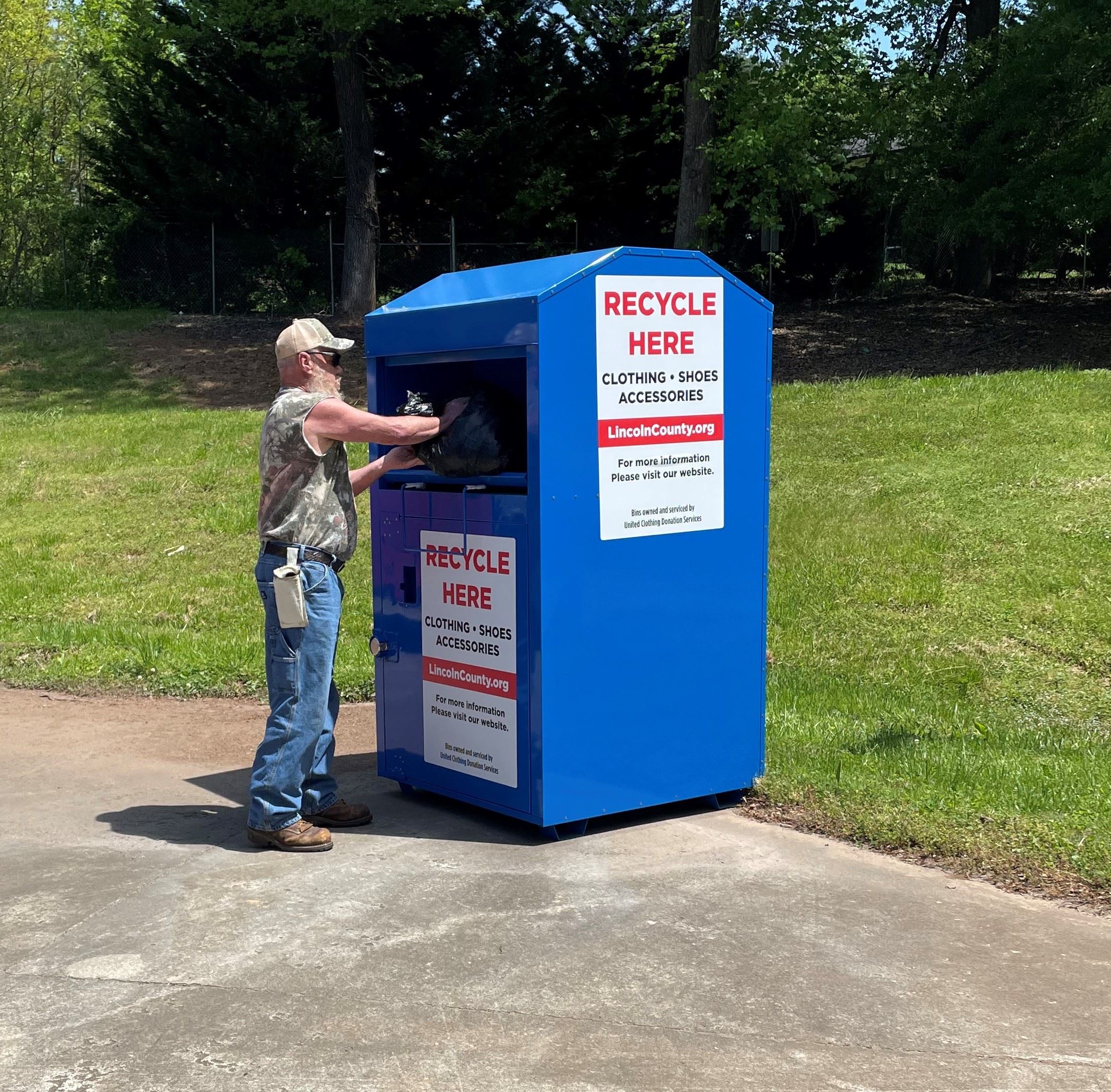 Resident Placing Items in Textile Bin